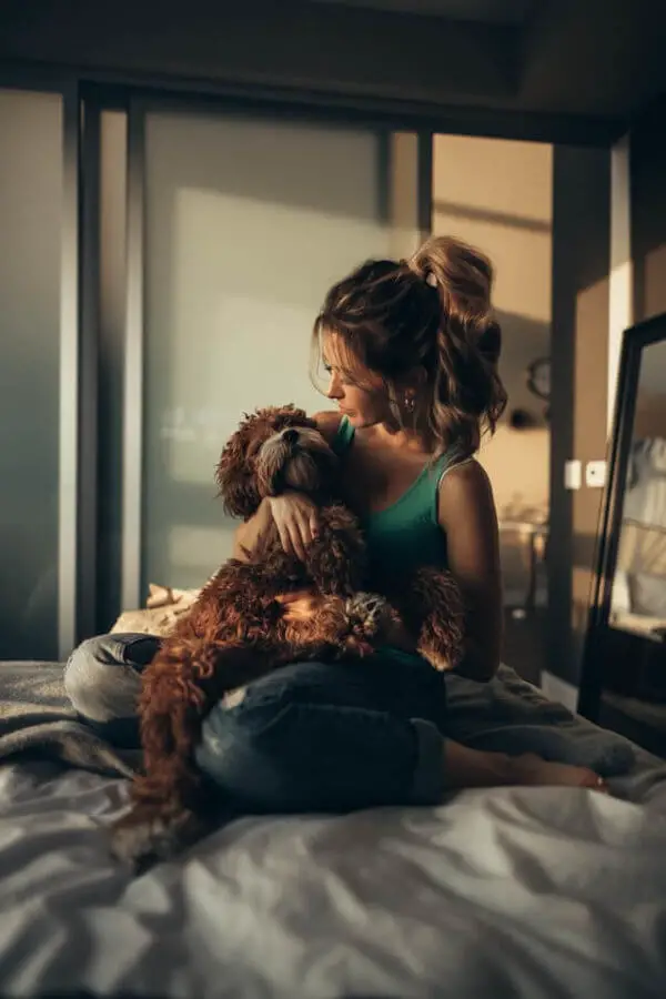 women_and_dog_on_bed.jpeg