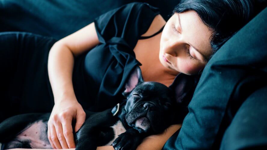 women_sleeping_with_clean_dog.jpeg